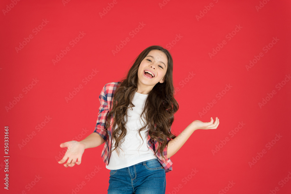 Lets have fun. Come on. Carefree and joyful. Kid girl carefree expression. I do not know. Take it easy. Child with long curly hair feeling cheerful and carefree. Happy childhood. Fun and relax Lets have fun. Come on. Carefree and joyful. Kid girl carefree expression. I do not know. Take it easy. Child with long curly hair feeling cheerful and carefree. Happy childhood. Fun and relax