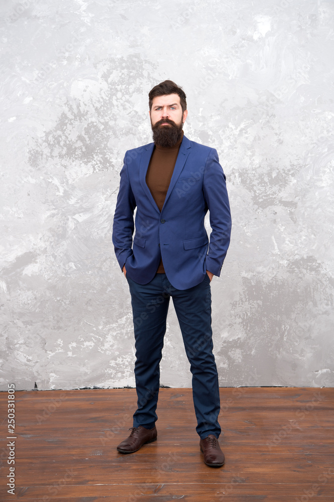 Classy style. Man bearded hipster wear classic suit outfit. Formal outfit.  Take good care of suit. Elegancy and male style. Businessman or host  fashionable outfit grey background. Fashion concept Stock Photo