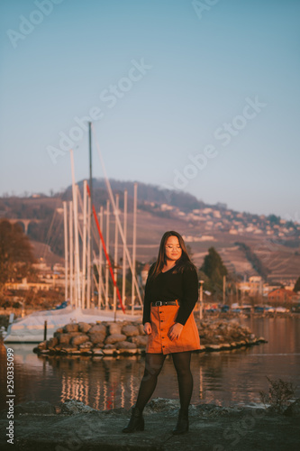 Outdoor portrait of asian plus size model posing by the lake © annanahabed