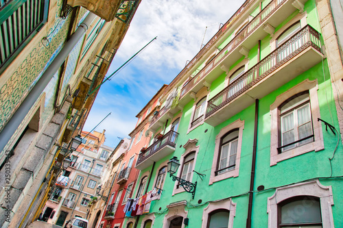 Colorful buildings of Lisbon historic center near landmark Rossio Square © eskystudio