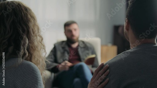 Happy married couple on reception at the psychotherapist
