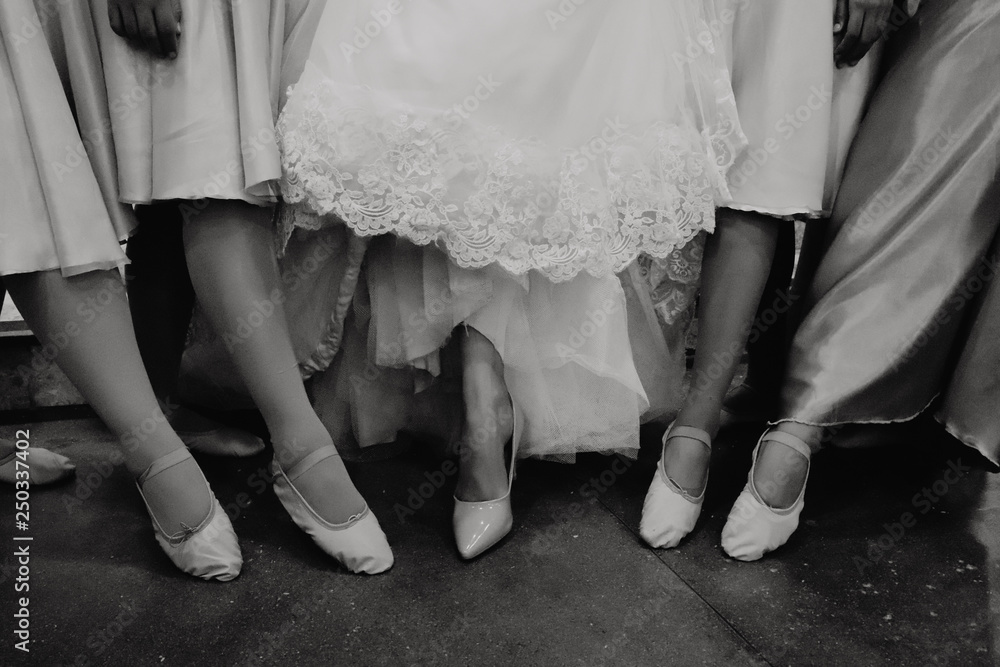 feet of bride in white dress