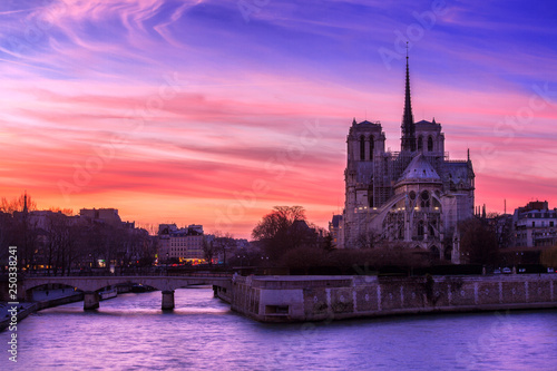 Sunset over the Notre Dame Cathedral in Paris, France