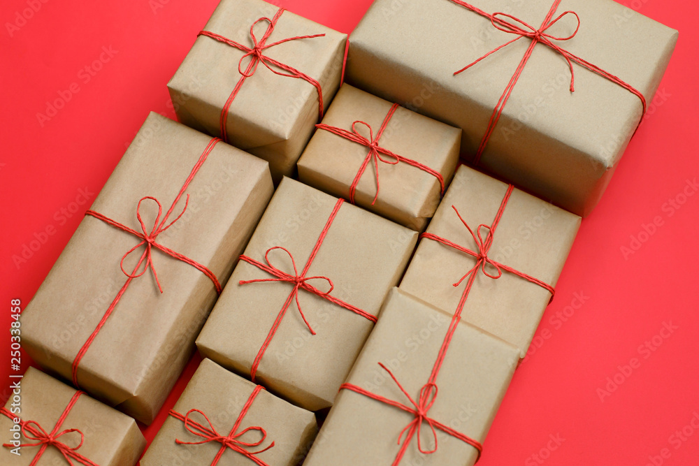 Fototapeta premium Handcrafted gifts with red twine bakground, Natural deisgn.