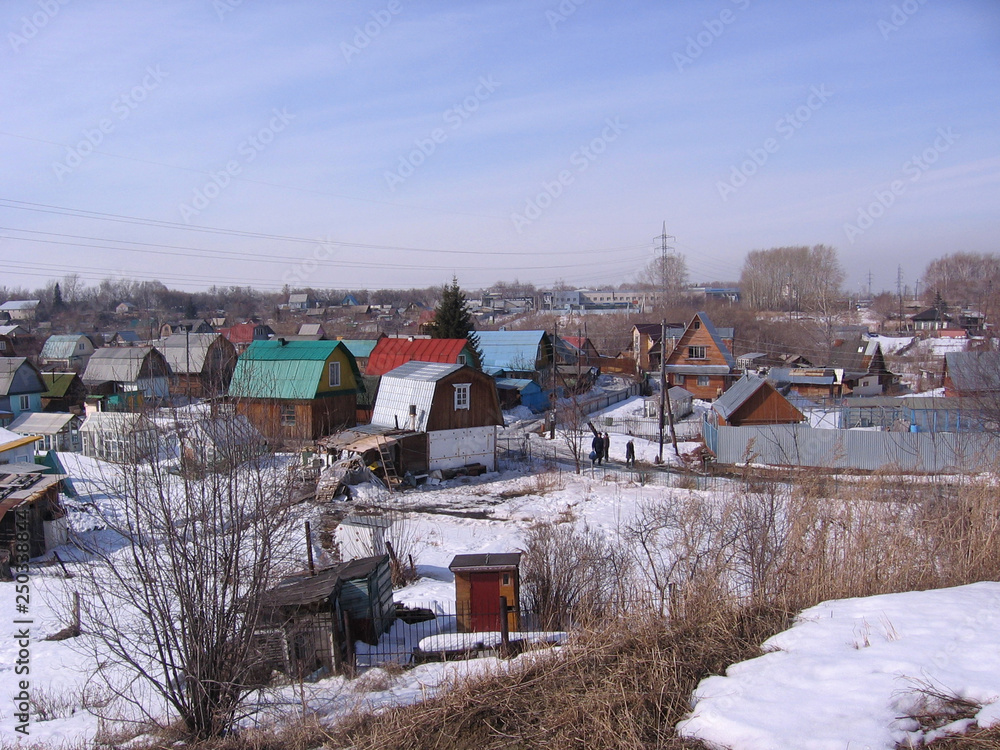 view of the suburban village of old, historical, low-rise, buildings wooden houses winter Novosibirsk