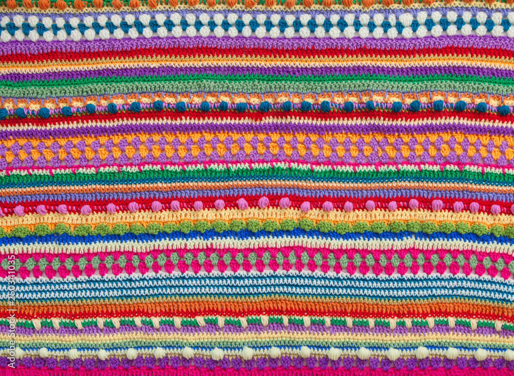 Knitted color background. Knitted texture. A sample of knitting from wool. Knitting Pattern. Knitted color background. Knitted texture. A sample of knitting from wool. Knitting Pattern.