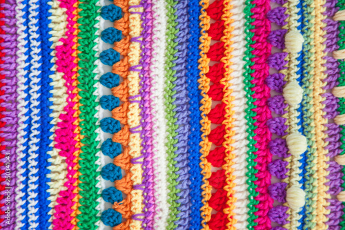 Knitted color background. Knitted texture. A sample of knitting from wool. Knitting Pattern.