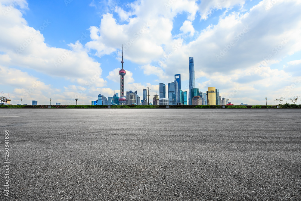 Empty asphalt square ground and Shanghai business district cityscape Empty asphalt square ground and Shanghai business district cityscape