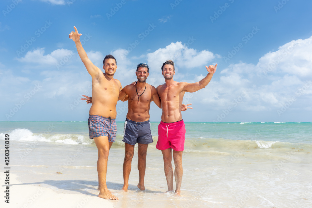 Group of mens having fun at the beach Group of mens having fun at the beach