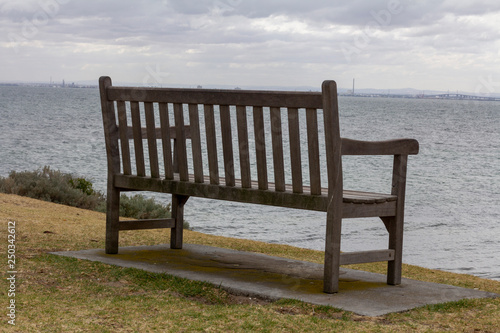 Alone Wood Bench and view to the Sea Landscape. Melbourne, Australia.