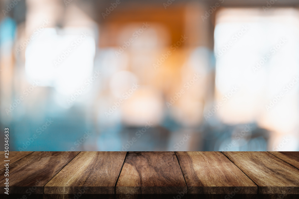 Empty wood table with blur cafe background. Empty wood table with blur cafe background.