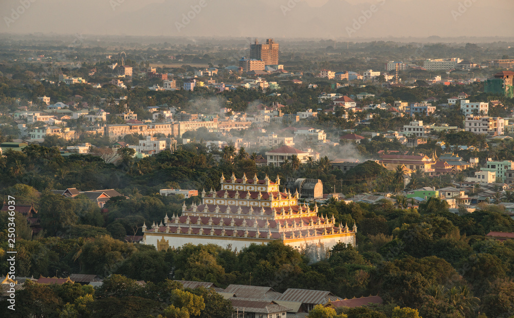 Aerial view of Atumashi monastery and Mandalay town at sunset view from Mandalay hills.