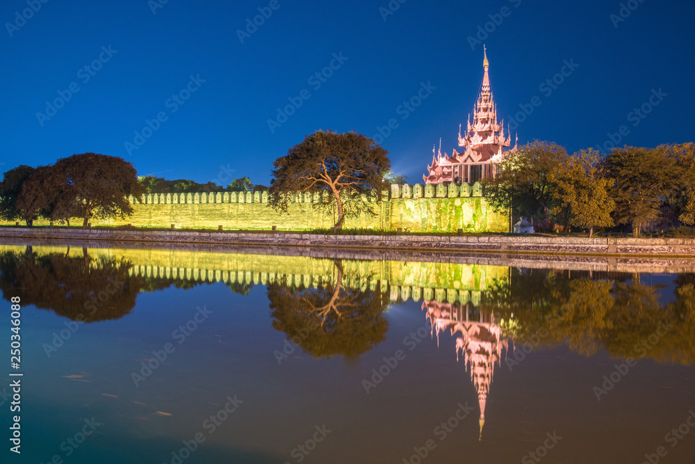 The reflection view of Mandalay palace wall and moat at twilight. The last palace built by Burmese Royals. The reflection view of Mandalay palace wall and moat at twilight. The last palace built by Burmese Royals.
