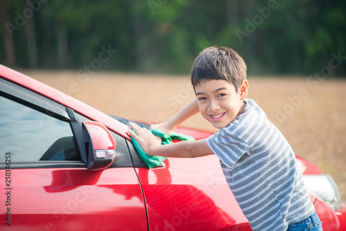 Little boy cleaning car © wckiw