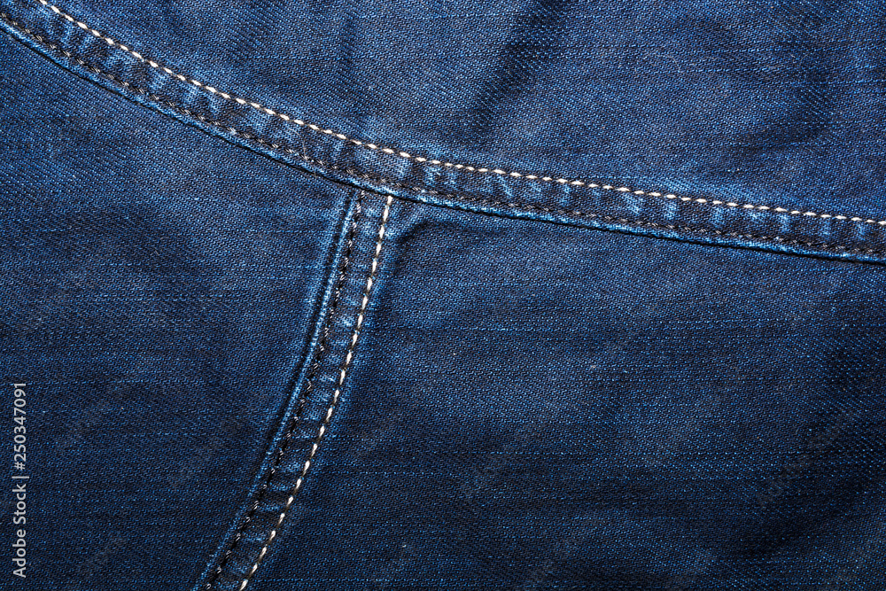 Naklejka premium Shabby denim texture for background. Blue jeans 