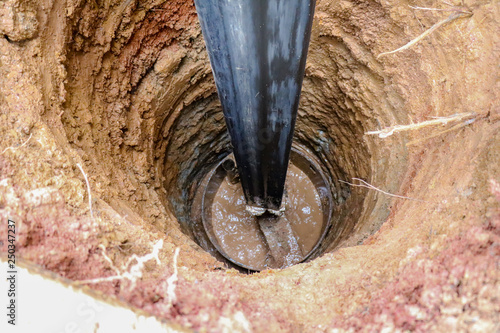 Water Well Drilling, holes boring in ground with drilling rig machine