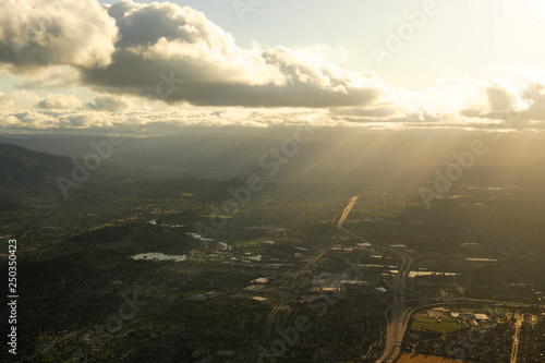aerial view of sunlight from behind cloud on the land