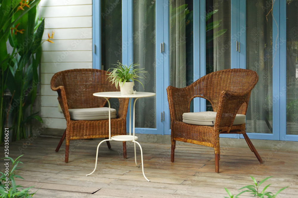 Vintage rattan chair with coffee table on patio
