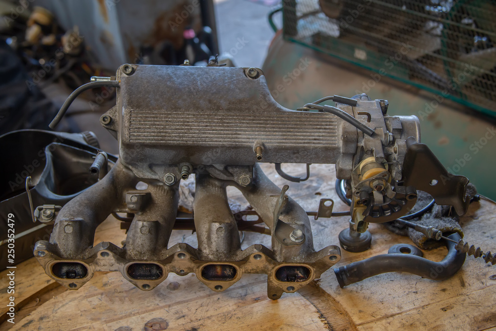 Used engines,Auto mechanic repairing car. Used engines,Auto mechanic repairing car.