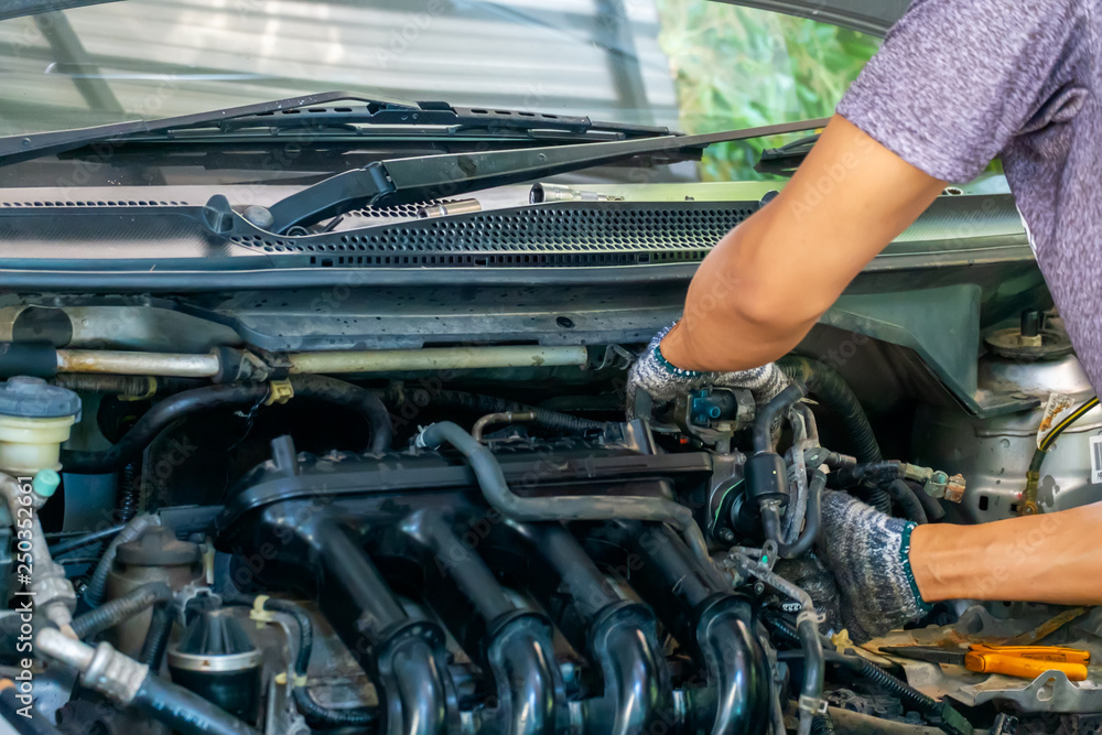 Auto mechanic repairing car. Selective focus in Thailand Auto mechanic repairing car. Selective focus in Thailand