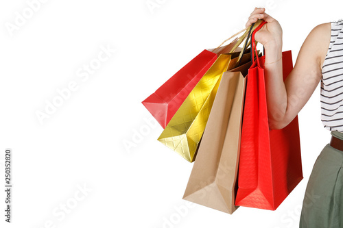 Shopping woman holding shopping bags, isolated on white studio background with copy space, E-commerce digital marketing lifestyle concept