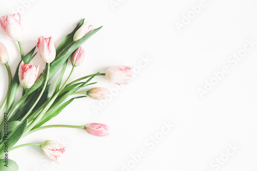 Fototapeta Naklejka Na Ścianę i Meble -  Flowers composition. Bouquet made of pink tulip flowers on white background. Valentines day, mothers day, womens day, spring, easter concept. Flat lay, top view, copy space