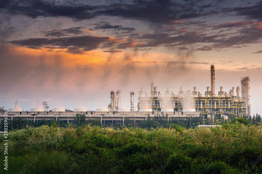 Cooling Tower of Oil and Gas Refinery Plant at Sunset. Process Buildings of Petrochemical Manufacturing., Business Engineering and Power Energy, Chemical and Petroleum factory.