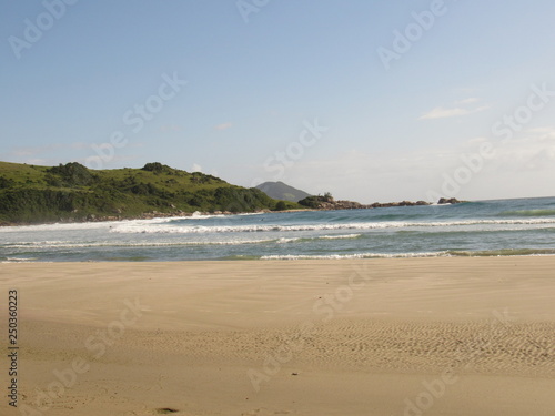  Beach, rocks, crystal clear water, trails, natural water pools, green plants and sun. © Douglas