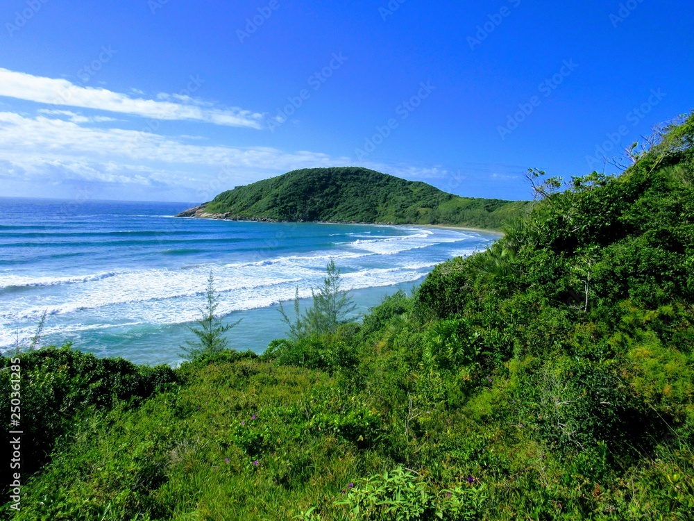 Beach, rocks, crystal clear water, trails, natural water pools, green plants and sun. Beach, rocks, crystal clear water, trails, natural water pools, green plants and sun.