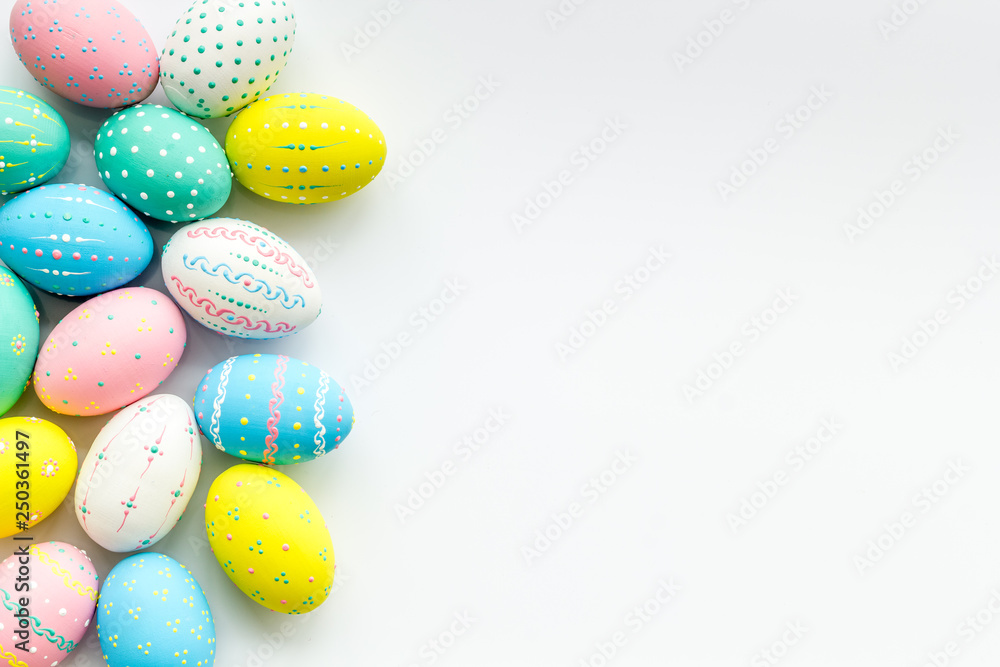 Decorated Easter eggs on white background border copy space