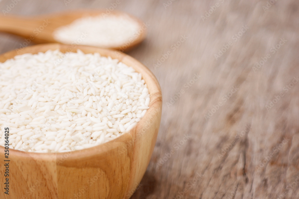 raw paddy rice in wooden bowl raw paddy rice in wooden bowl