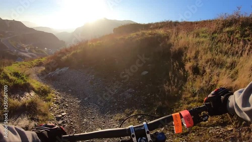 Onboard camera: Mountain biking downhill in stone road in Slate Mountain, Great Britain. View from first person perspective POV. 50 fps