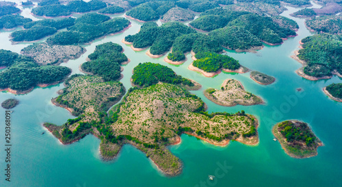 (View from above) Stunning aerial view of a beautiful group of island in Nam Ngum Reservoir in Thalat located in northern Laos. photo