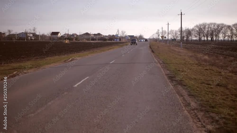 the road runs far, against the backdrop of a country landscape the road runs far, against the backdrop of a country landscape