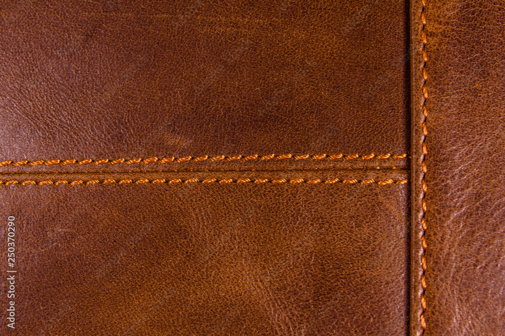 Texture of the natural brown leather and stitches Texture of the natural brown leather and stitches