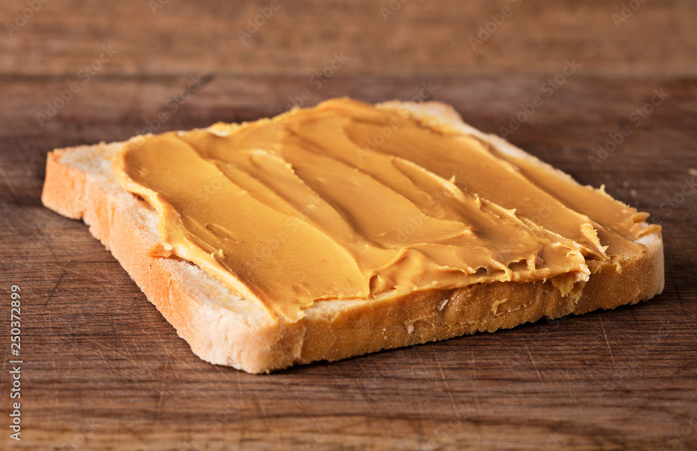 peanut butter sandwich on wooden background