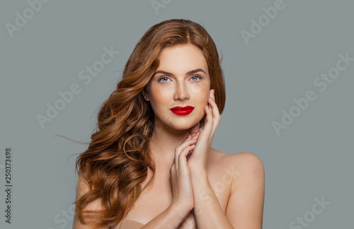 Beauty portrait of woman with long curly beautiful ginger hair
