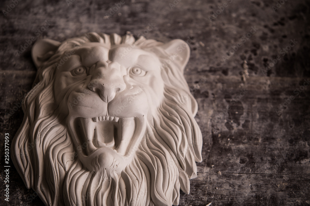 Creation of sculpture from plaster. Lion's head. Plaster workshop. Tooling. Creation of sculpture from plaster. Lion's head. Plaster workshop. Tooling.