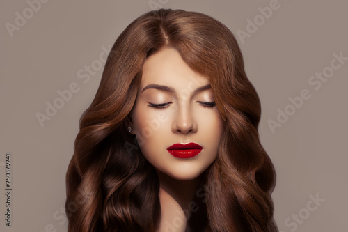 Pretty redhead woman. Beautiful redhead girl with wavy haircut and perfect makeup, cute face closeup