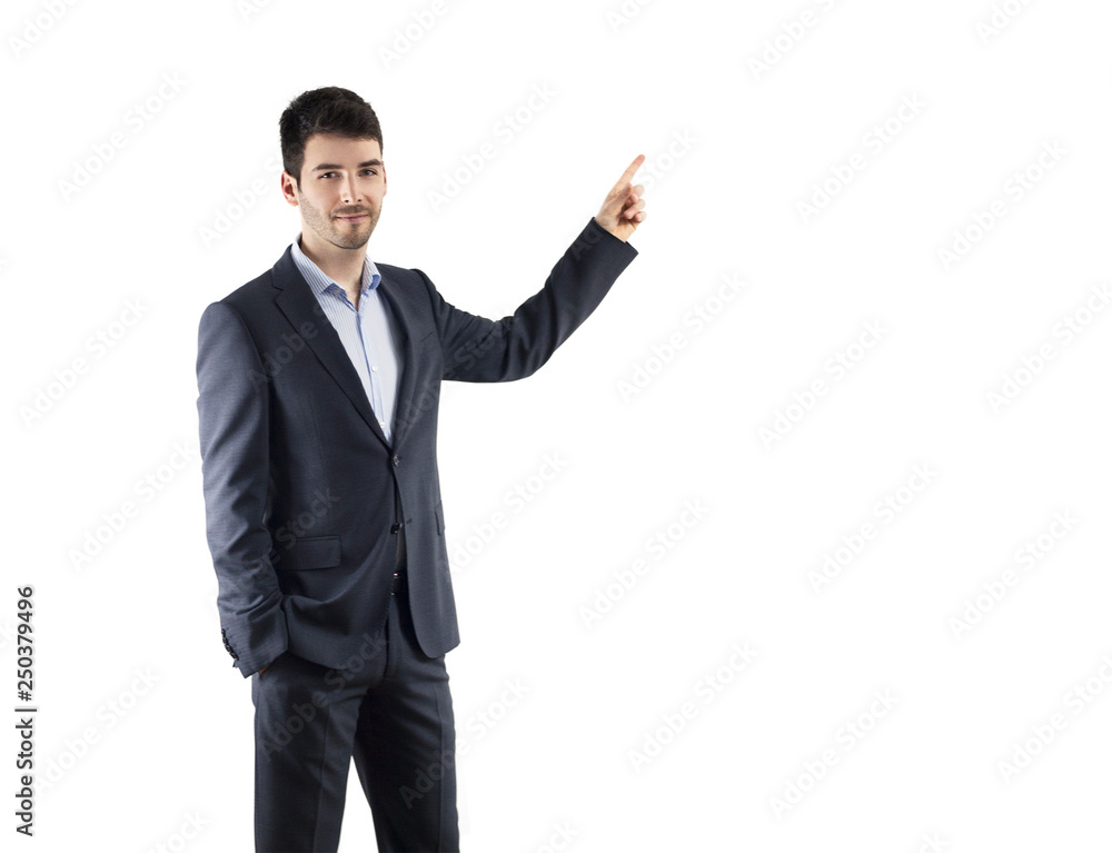 Businessman dressed in a suit pointing at something Businessman dressed in a suit pointing at something