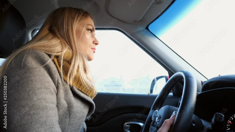 Young blonde woman driving car in in the daytime, 4k Young blonde woman driving car in in the daytime, 4k