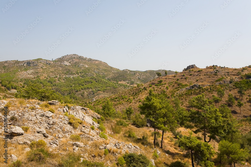 Mountain landscape of Turkey with agricultural landings.