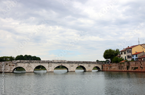 stone Tiberius bridge Rimini cityscape Italy © goce risteski