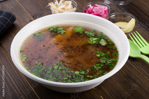 Vientamese traditional beef noodle soup pho bo with ingredients