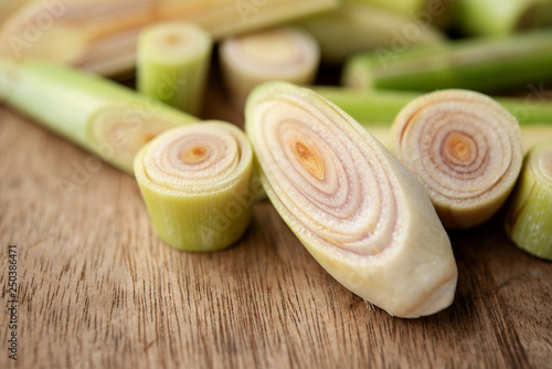 Canvas Print lemongrass slices on wood background.