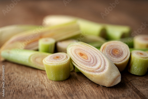 Canvas Print lemongrass slices on wood background.