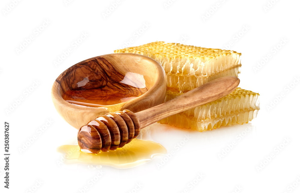 Luquid honey and Honeycomb with wooden spoon Luquid honey and Honeycomb with wooden spoon