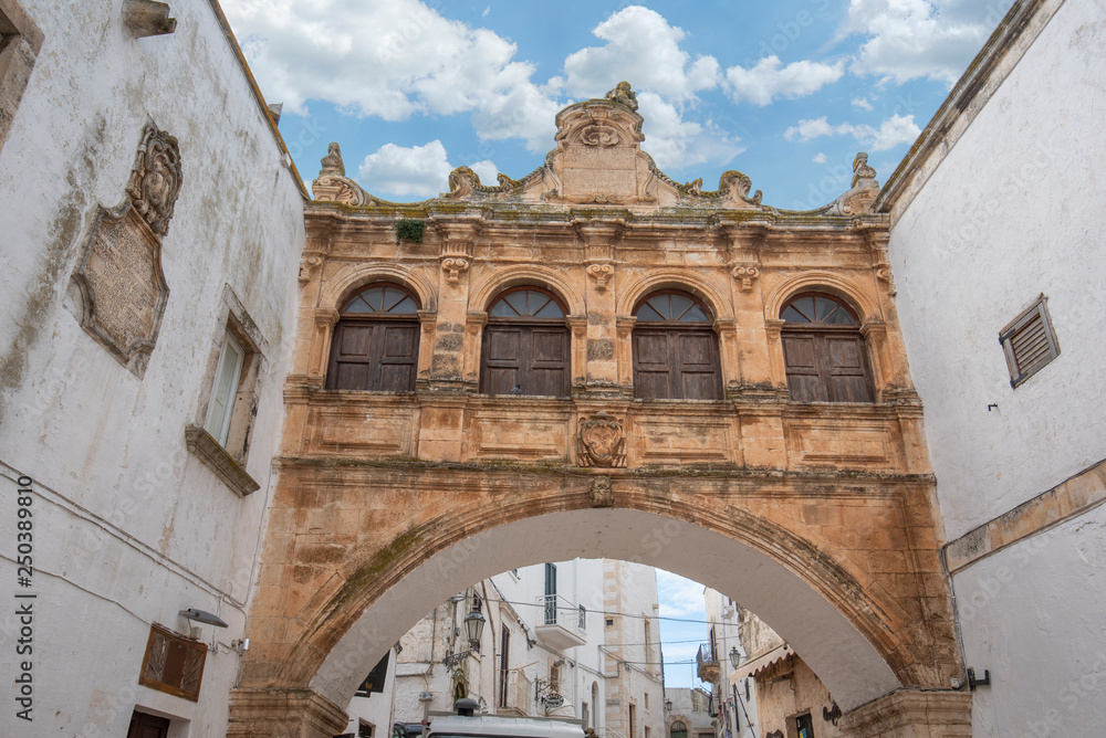 Arco Scoppa of Ostuni, La Citta Bianca (The White Town) Apulia. The Scoppa arch of bishop's palace front of the cathedral in Ostuni, Puglia, Italy