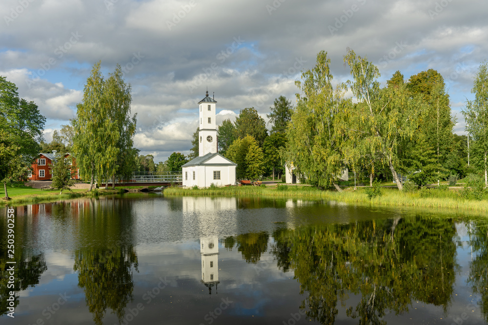 Fototapeta premium White watch tower glowing in summer sunshine