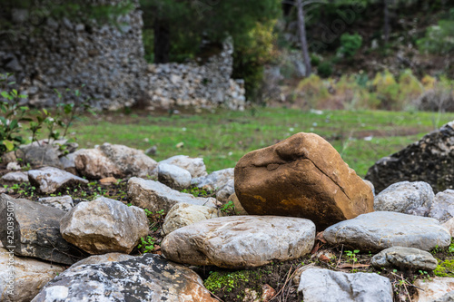 large stones on the background of ruins and forests
